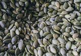 Raw green pumpkin seeds, Vanilla Protein powder jar, Protein smoothie banana plant milk, Pumpkin seeds close up texture, Vanilla Protein ingredients flat lay